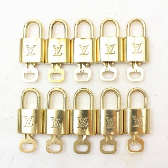 Louis Vuitton Handbags - Authentic Louis Vuitton padlock key and lock set